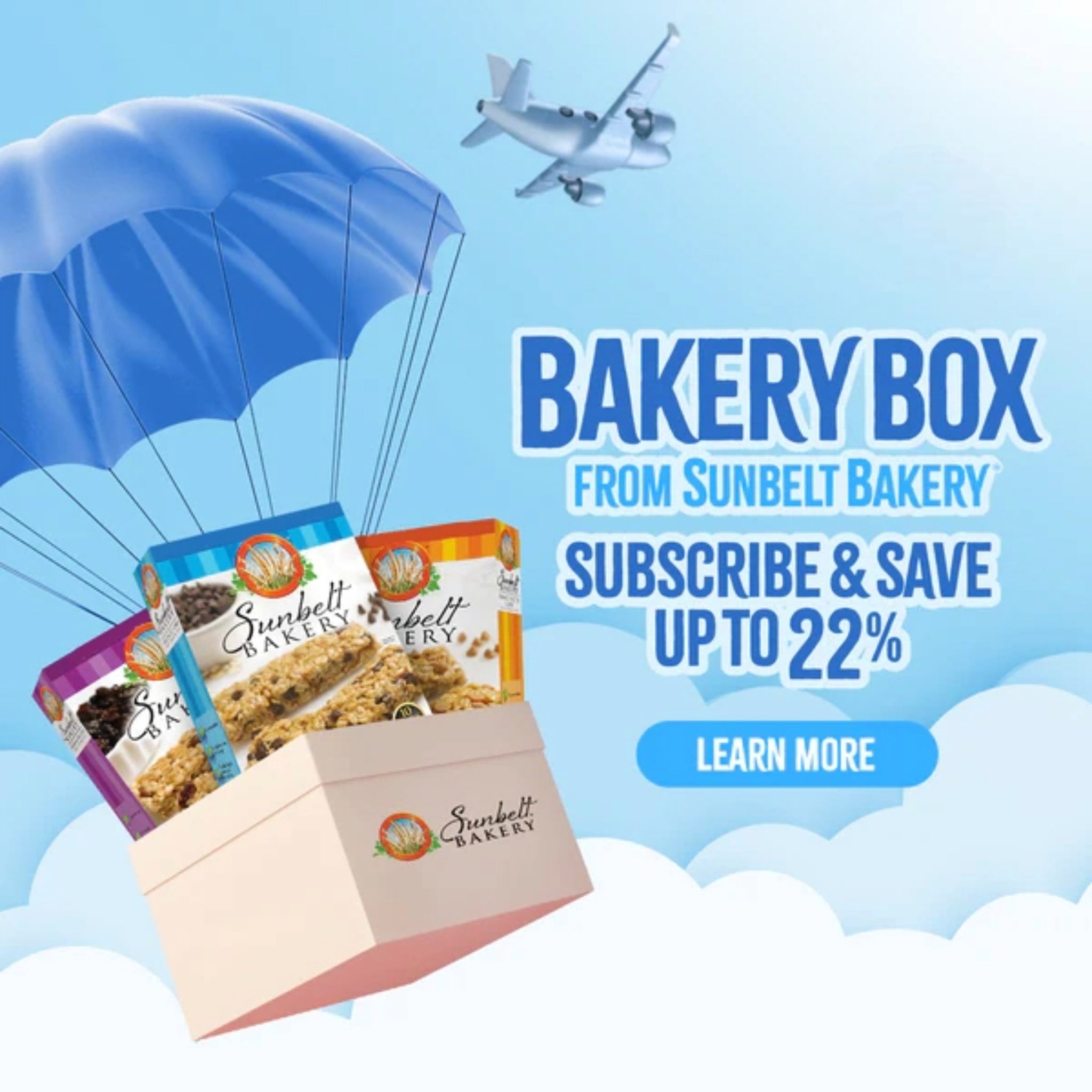 A Sunbelt Bakery–branded box filled with three colorful granola bar packages descending beneath a large blue parachute in a cloudy sky. A small airplane flies overhead. Text on the image reads: ‘BAKERY BOX from Sunbelt Bakery – Subscribe & Save up to 22%. Learn More.’