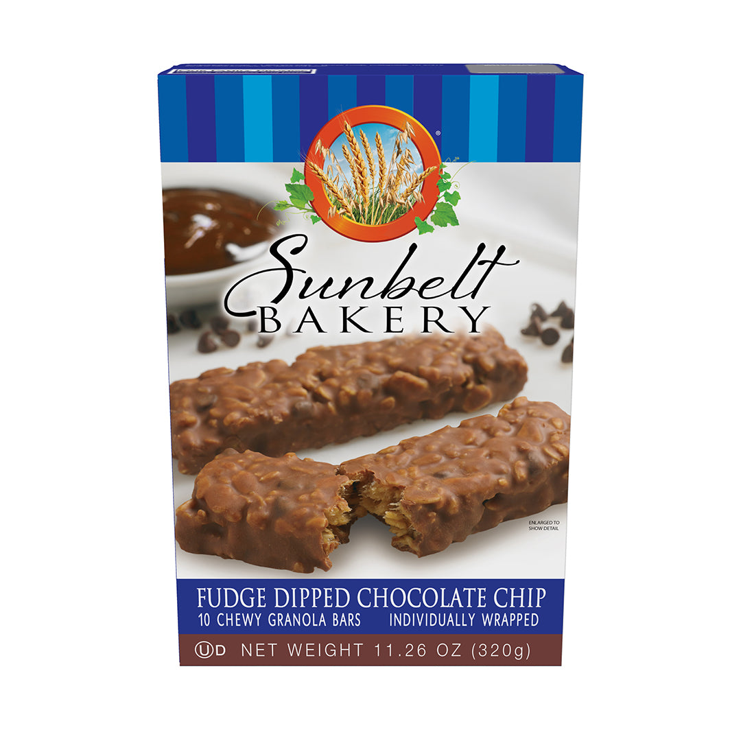 Box of Sunbelt Bakery Fudge Dipped Chocolate Chip Chewy Granola Bars, with a blue stripe design on the top. The front of the box features images of granola bars enrobed in fudge, with one bar broken in half to show the interior. The Sunbelt Bakery logo with a circle of wheat stalks is above. Package details include '10 Chewy Granola Bars', 'Individually Wrapped', and a net weight of 11.26 oz (320g).